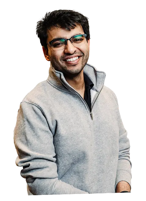 Silhouette of a person with arms crossed against a black background.